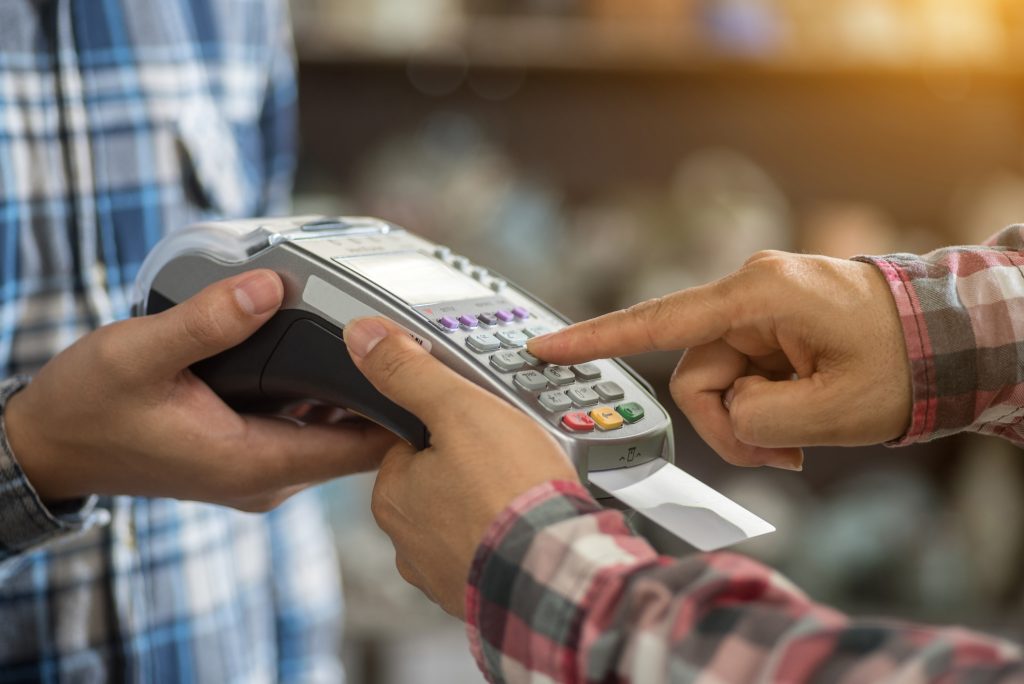 a finger press on credit card